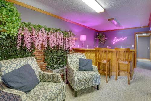 a waiting room with chairs and a wall with flowers at Waterfront Bristol Area Retreat with Boat Dock in Blountville