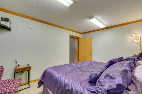 a bedroom with a purple bed and a desk at Waterfront Bristol Area Retreat with Boat Dock in Blountville