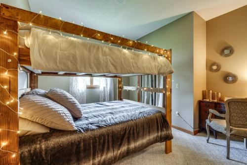 a bedroom with a canopy bed with lights at Waterfront Bristol Area Retreat with Boat Dock in Blountville