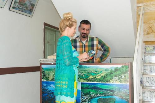 a man taking a picture of a woman at Yakut Apart Hotel in Dalyan