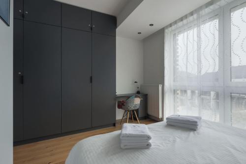 Säng eller sängar i ett rum på Apartament 1N2 taras z widokiem - Sun&Sport