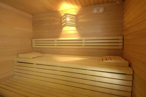a wooden sauna with two beds in it at Hotel Panorama in Molveno
