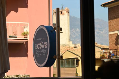 a sign on the side of a building next to a window at Gardesana Active Apartments in Malcesine