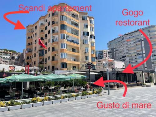 a view of a city with red arrows pointing to a building at Scandi Apartaments in Durrës