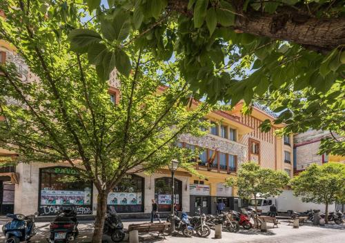 a group of motorcycles parked in front of a building at Apartamento 1 hab en La Latina - Madrid Centro in Madrid