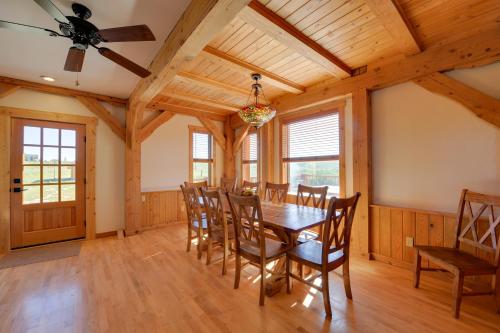 a dining room with a table and chairs at 23 Mi to Targhee Skiing Felt Cabin with Hot Tub! in Felt