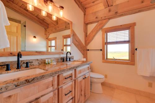 a bathroom with a sink and a toilet at 23 Mi to Targhee Skiing Felt Cabin with Hot Tub! in Felt