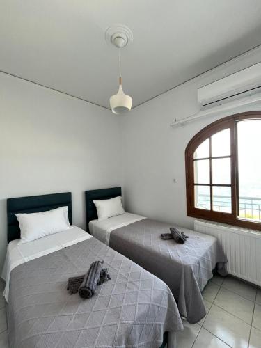 Postel nebo postele na pokoji v ubytování Blue Wave Apartment