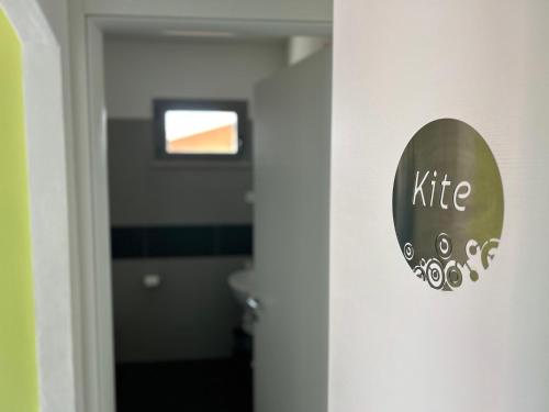 a door with a sign that reads kite on it at Gardesana Active Apartments in Malcesine