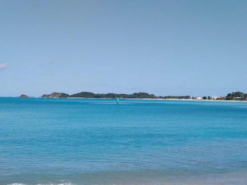 a large body of blue water with trees in the distance at yambaru guest house B - Vacation STAY 02756v in Ujimi
