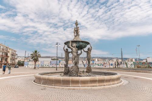 a fountain in the middle of a street at Marina del Gargano Houseboat in Manfredonia