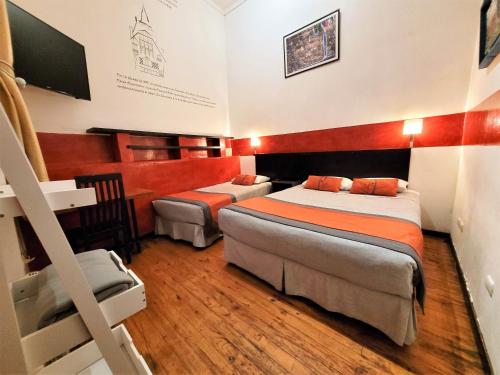 Maki Hostels & Suites Valparaisoにあるベッド