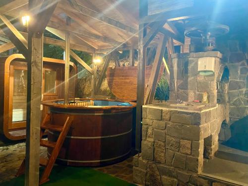 a bath room with a tub in a house at Cabana Miska Chalet in Miercurea-Ciuc