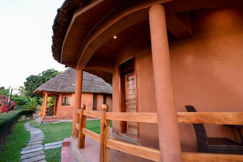 a building with a fence in front of it at Divine Resort & Spa in Kampala
