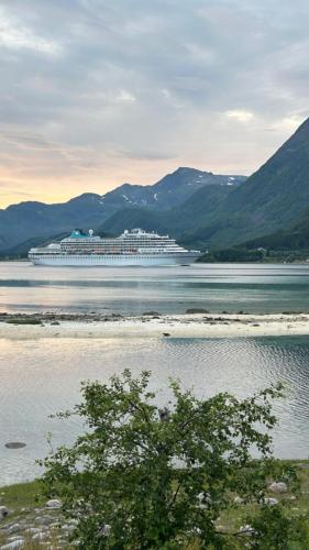 a large cruise ship in a large body of water at Sand Beachhouse in Sand