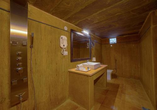 a small bathroom with a sink and a toilet at Sky View in Jaisalmer
