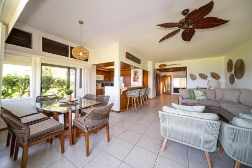 a living room with a couch and a table at Kapalua Villas Maui - Select Your Unit in Kahana