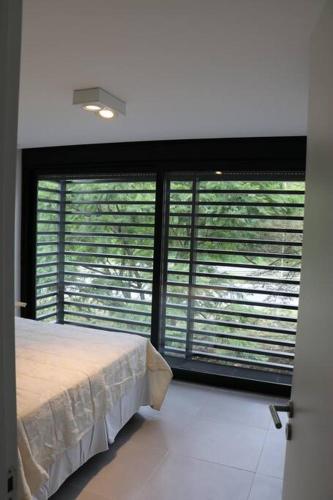 Ένα ή περισσότερα κρεβάτια σε δωμάτιο στο Departamento 1 Habitación Completamente Equipado