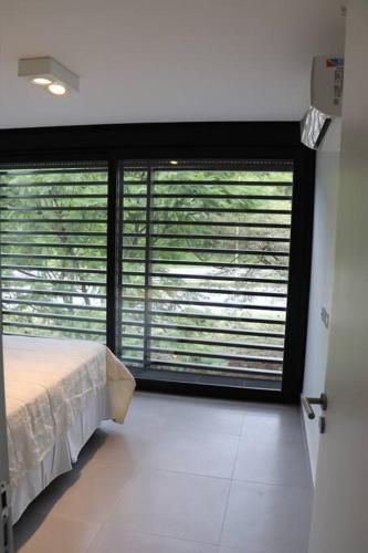 Ένα ή περισσότερα κρεβάτια σε δωμάτιο στο Departamento 1 Habitación Completamente Equipado