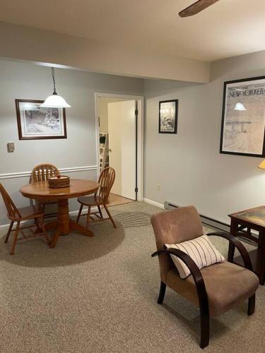 a living room with a table and chairs at SKIING, HIKING, VILLAGE OF EVILLE MTN ESCAPE in Ellicottville