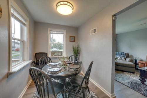 a dining room with a table and chairs at Deck and Patio Inviting Abode in Natrona Heights! in Natrona Heights