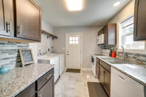 a kitchen with a sink and a counter top at Deck and Patio Inviting Abode in Natrona Heights! in Natrona Heights