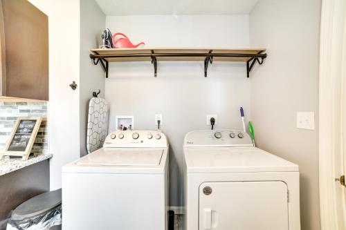 a laundry room with two washer and dryer at Deck and Patio Inviting Abode in Natrona Heights! in Natrona Heights
