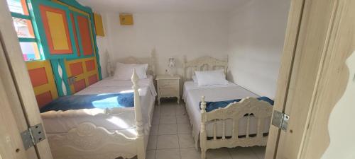 Katil atau katil-katil dalam bilik di Casa Familiar María E