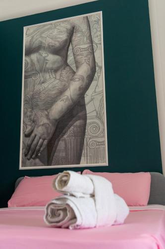 Postel nebo postele na pokoji v ubytování La corte di poppea