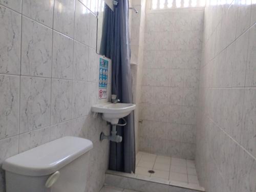 a bathroom with a toilet and a sink at Hotel Las Vegas by CMS hotels in Santa Marta