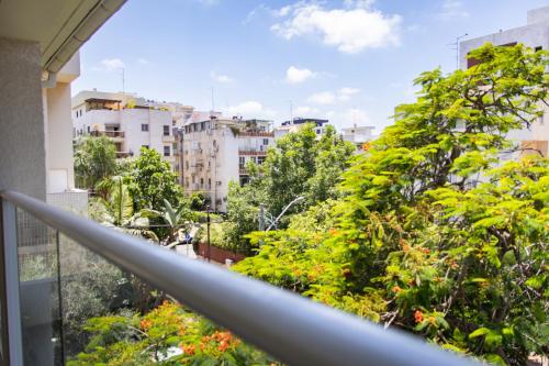 a view of a city from a balcony at Boutique Penthouse by Weizmann - פנטהאוס בוטיק in Rechovot
