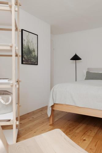 Postel nebo postele na pokoji v ubytování Das Grüne Haus - Boutique Apartments ecofriendly