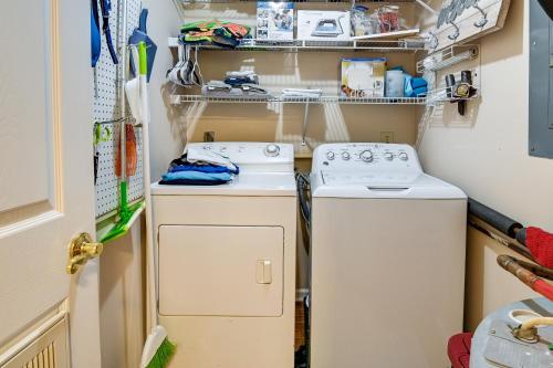 a small laundry room with a washer and dryer at Surfside Beach Condo with Ocean Access and Balcony! in Myrtle Beach