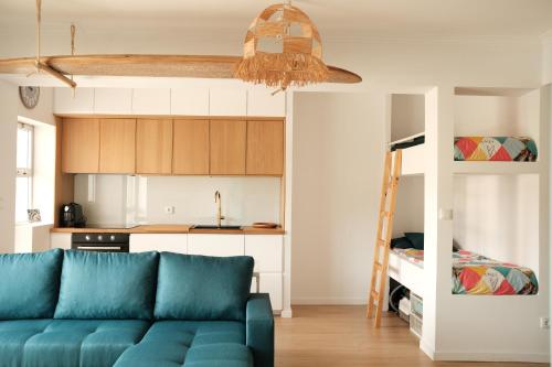 a living room with a couch and a bunk bed at Furadouro Cool & Cozy Flat in Furadouro