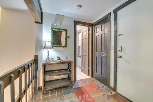 a hallway with a door and a table with a lamp at 4 Mi to Windham Mountain Ski Getaway! in Windham