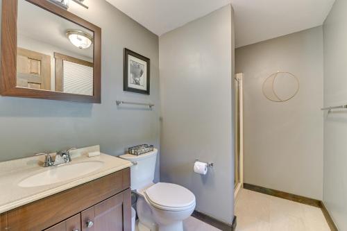 a bathroom with a toilet and a sink and a mirror at 4 Mi to Windham Mountain Ski Getaway! in Windham