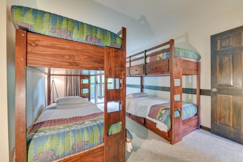 a bedroom with two bunk beds in a house at Immaculate Winter Getaway Near Skiing and Hiking! in Windham