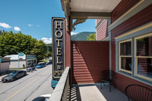 a sign for a pub on the side of a building at Kaslo Hotel in Kaslo
