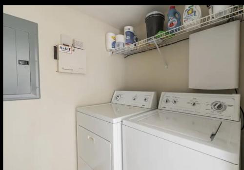 a laundry room with a washer and dryer at Bill’s On Little Pigeon River in Pigeon Forge