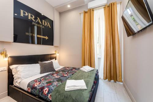 A bed or beds in a room at Empire Suites