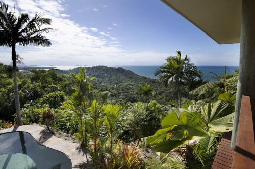 a view of the ocean from a house at The Jungle House - 2 Bedroom Home - Bingil Bay in Mission Beach