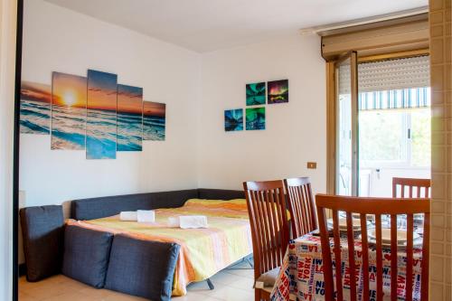 a bedroom with a bed and a table and chairs at [600 metri dal mare] Relax con fresco terrazzo in Marina di Andora