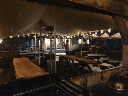 a large kitchen with a table and a table at Sutton Coldfield 2-Bed Caravan Parking & Bar-B-Q in Sutton Coldfield
