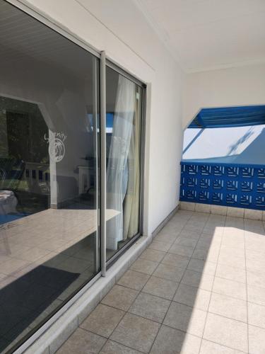 a room with a window with a view of a patio at Serenity Nhabanga, Bilene in Nhabanga
