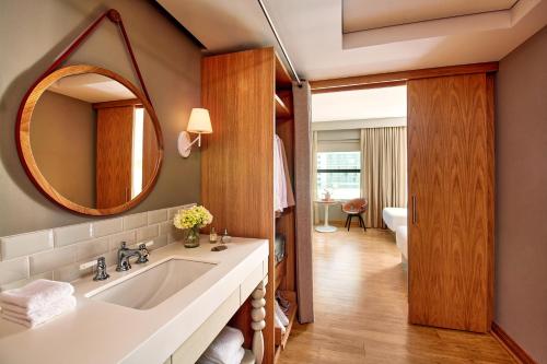 a bathroom with a sink and a mirror at Virgin Hotels Chicago in Chicago