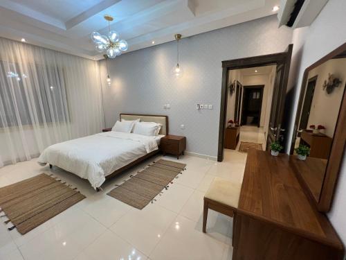 a bedroom with a large bed in a room at Loft 16 in Jeddah