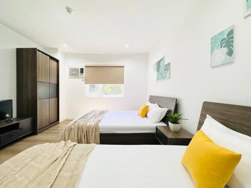 Postel nebo postele na pokoji v ubytování Mangrove Residences Mactan