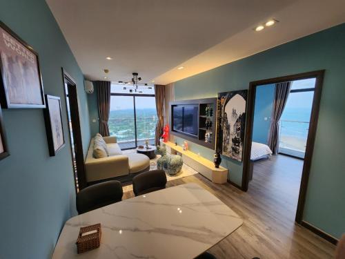 a living room with a view of the ocean at BEARBRICK homestay near beach, CSJ Tower Apartment Vung Tau in Vung Tau