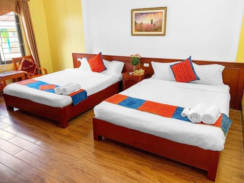 Postel nebo postele na pokoji v ubytování Cherry Hotel