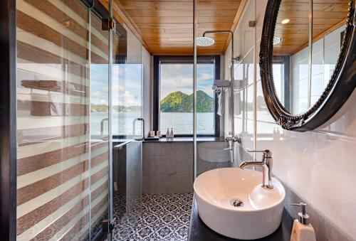 a bathroom with a sink and a window at Halong Dragon Bay Cruise in Ha Long